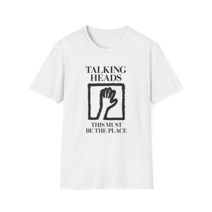 White t-shirt with "TALKING HEADS" and "THIS MUST BE THE PLACE" text and a hand graphic.
