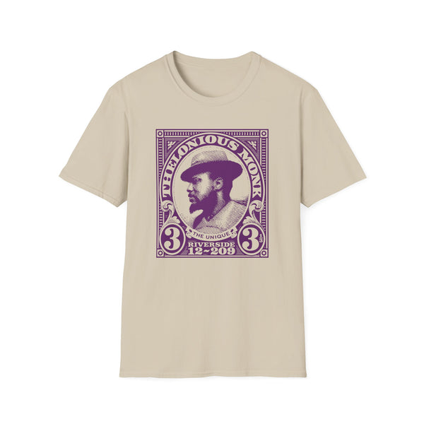 Thelonious Monk portrait on a beige t-shirt with purple stamp-like graphic.
