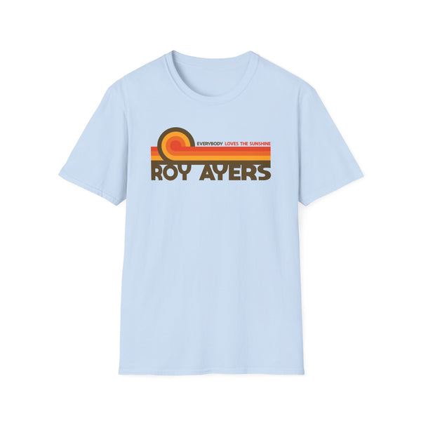 Light blue t-shirt with "Roy Ayers" and "Everybody Loves The Sunshine" text in retro stripes.